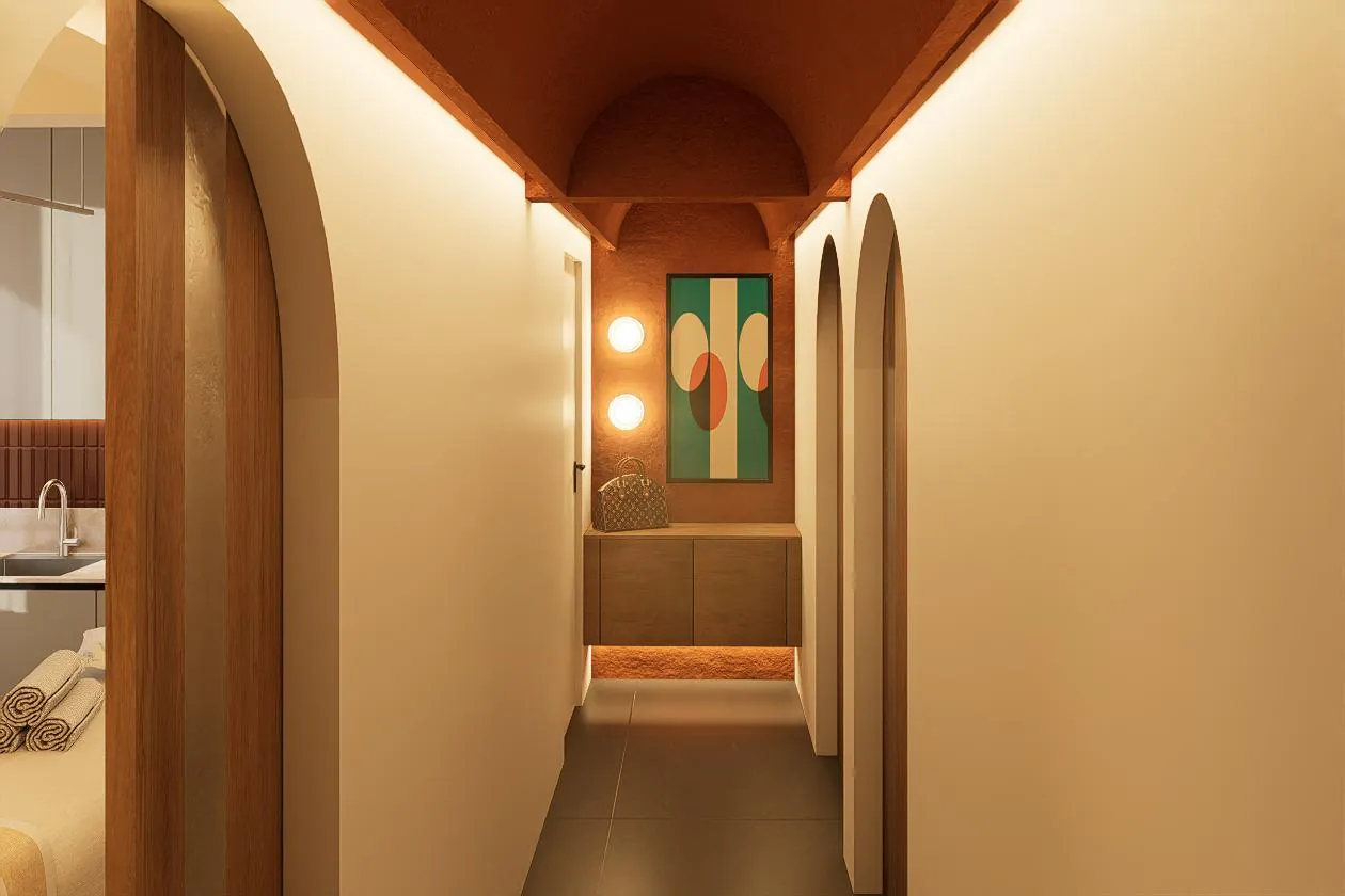 Arched corridor connecting treatment rooms through a softly lit hallway.